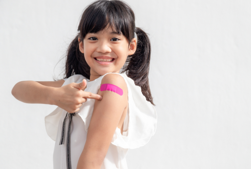 Child with a bandaid on their arm.