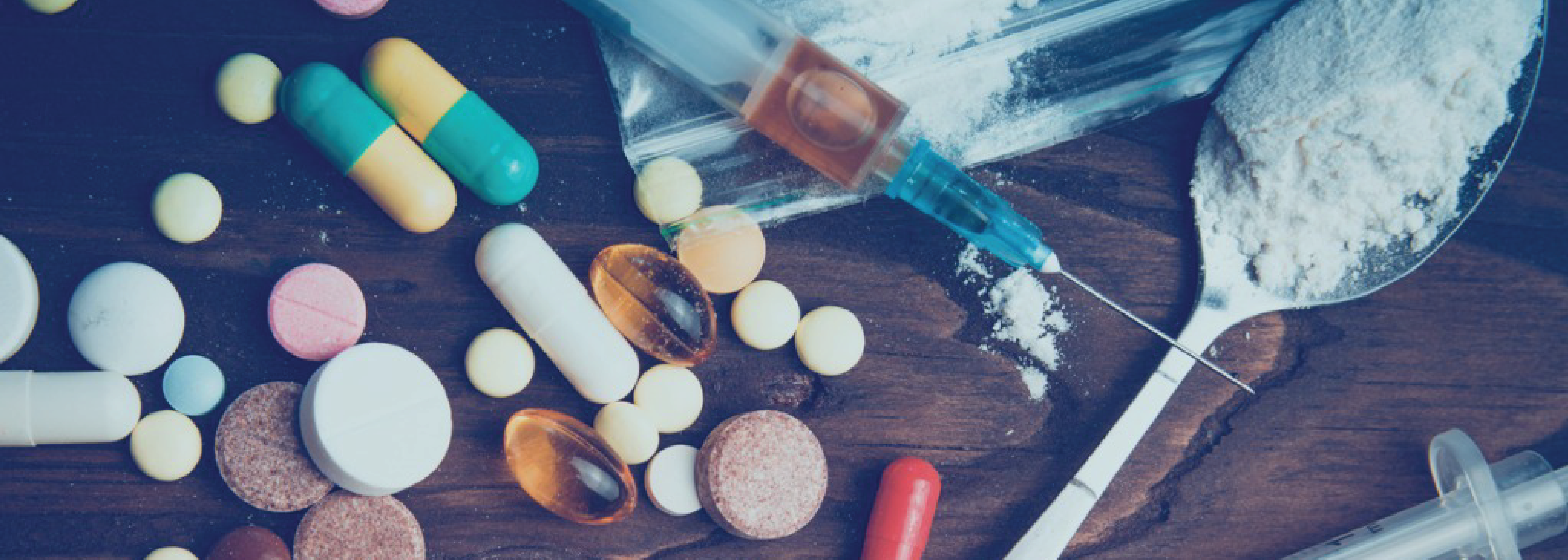 various types of drugs including cocaine, pills and needles