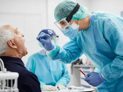 Picture of an elderly man being tested for an infectious disease