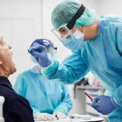 Picture of an elderly man being tested for an infectious disease