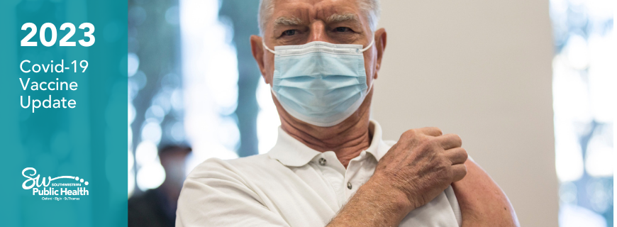 Senior man rolling up his sleeve for vaccine