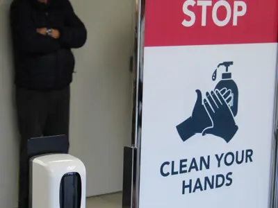 Picture of a sign asking people to wash their hands