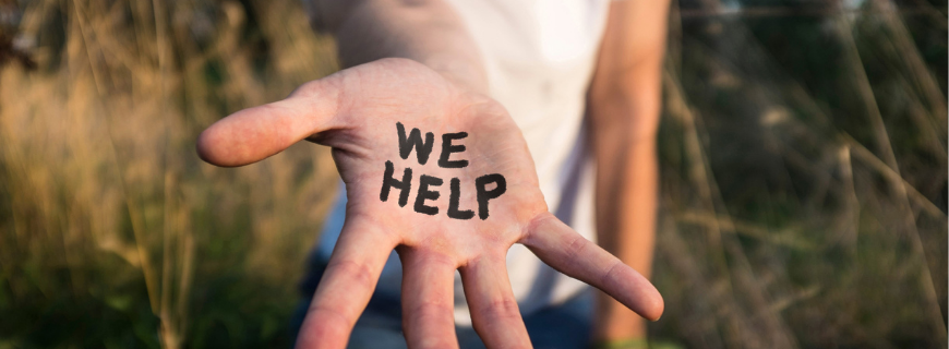 Picture of an outstretched hand with the words "we help"